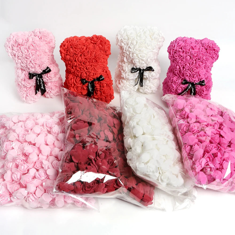 A collection of pink and red PE foam artificial rose flowers in various shades and colors, some shaped like teddy bears.