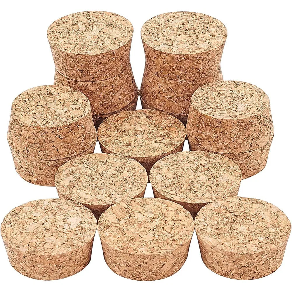 A collection of adhesive cork circles stacked and laid out for crafting and decoration.
