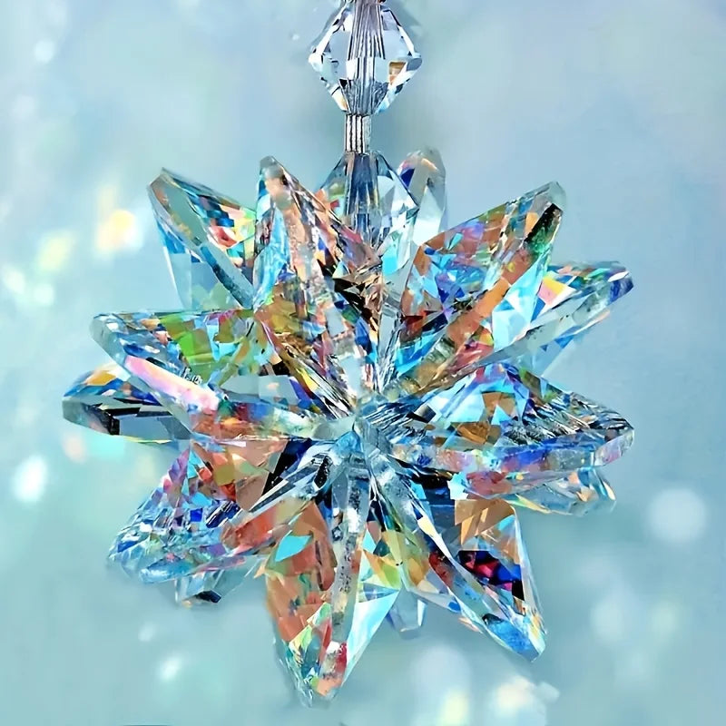 A sparkling crystal star ornament with iridescent blue and pink facets catching the light.