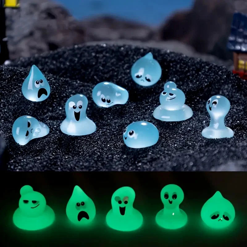 Set of eight glow-in-the-dark resin fairy water droplet figurines showing various facial expressions.