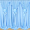 Elegant blue fabric party backdrop featuring draped curtains and spherical blue balloons