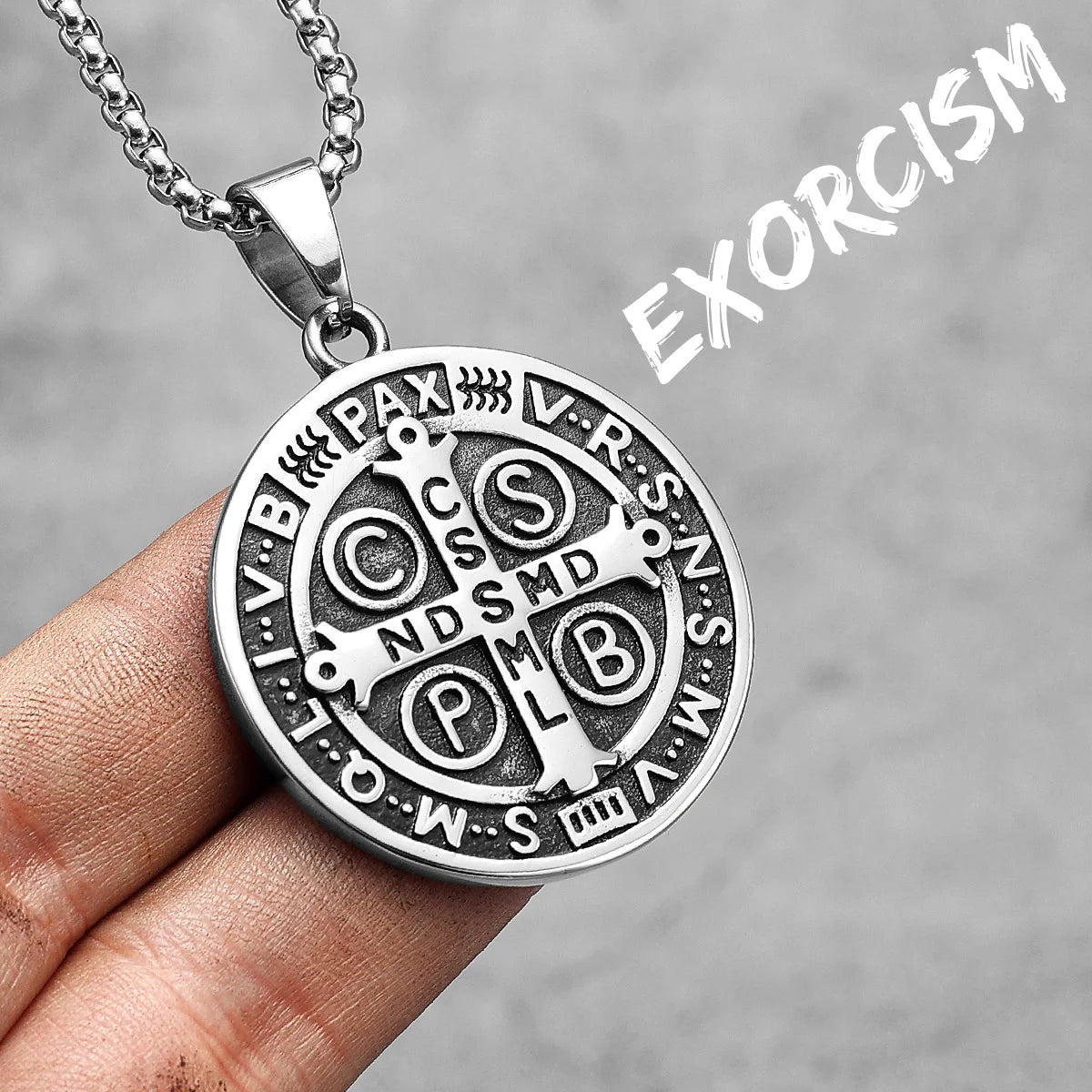 A silver stainless steel punk cross necklace with Roman numerals engraved on the pendant.