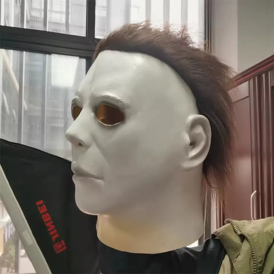A white latex mask with brown eyes is displayed on a mannequin head.
