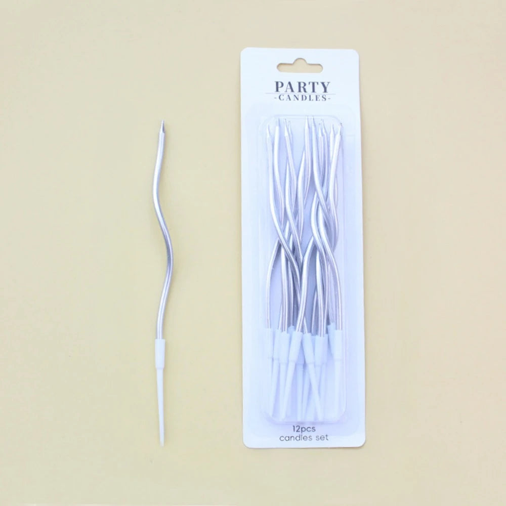 A package of 12 long thin silver spiral candles for parties
