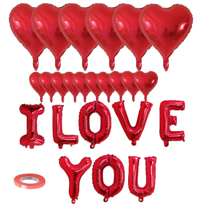 A set of red foil balloons shaped like the words I LOVE YOU and hearts