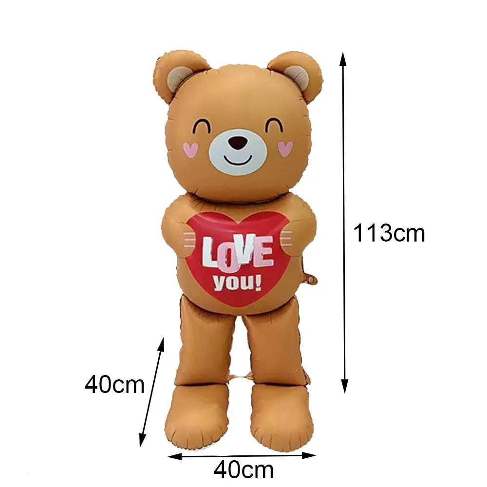 A plush teddy bear toy with a red heart design and text on its chest