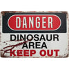 Vintage tin sign with a red danger warning and text saying Dinosaur Area Keep Out