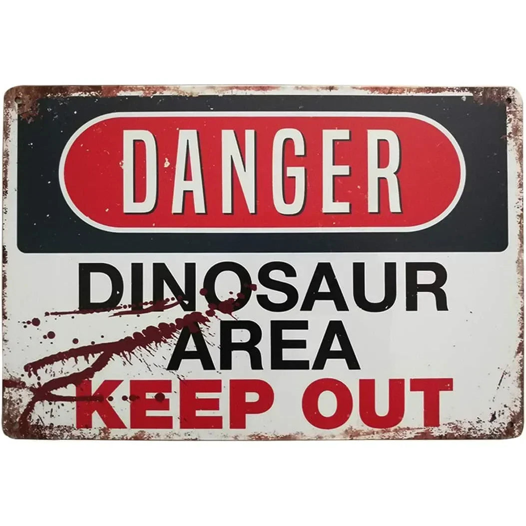 Vintage tin sign with a red danger warning and text saying Dinosaur Area Keep Out
