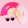Pink hand fans with the words Babe and Bride displayed on a pink background