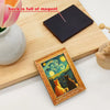 A wooden cutting board shows a dark magnet and a framed picture of cats under a starry sky.