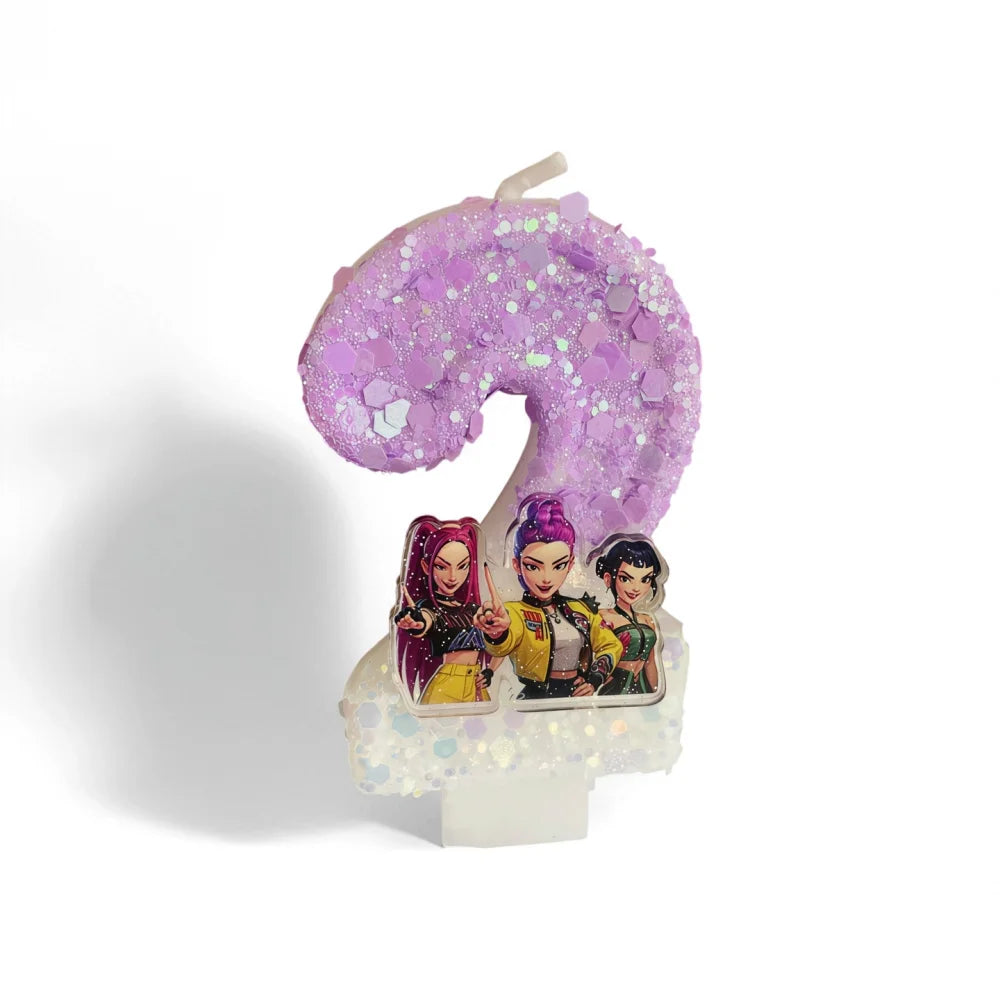 A purple glitter number nine candle shaped like a character from a show is displayed on a white stand.