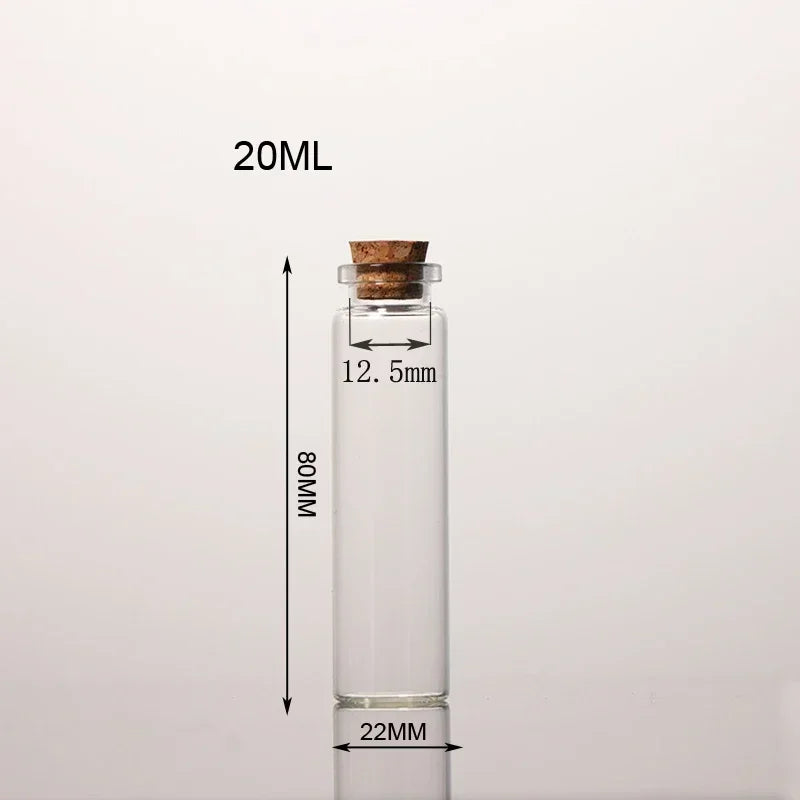 A clear glass bottle with a cork stopper, labeled 20ML, shown next to a measurement scale.