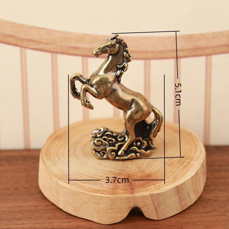 A solid copper horse figurine standing on a wooden base, measuring 5.1 cm in height.