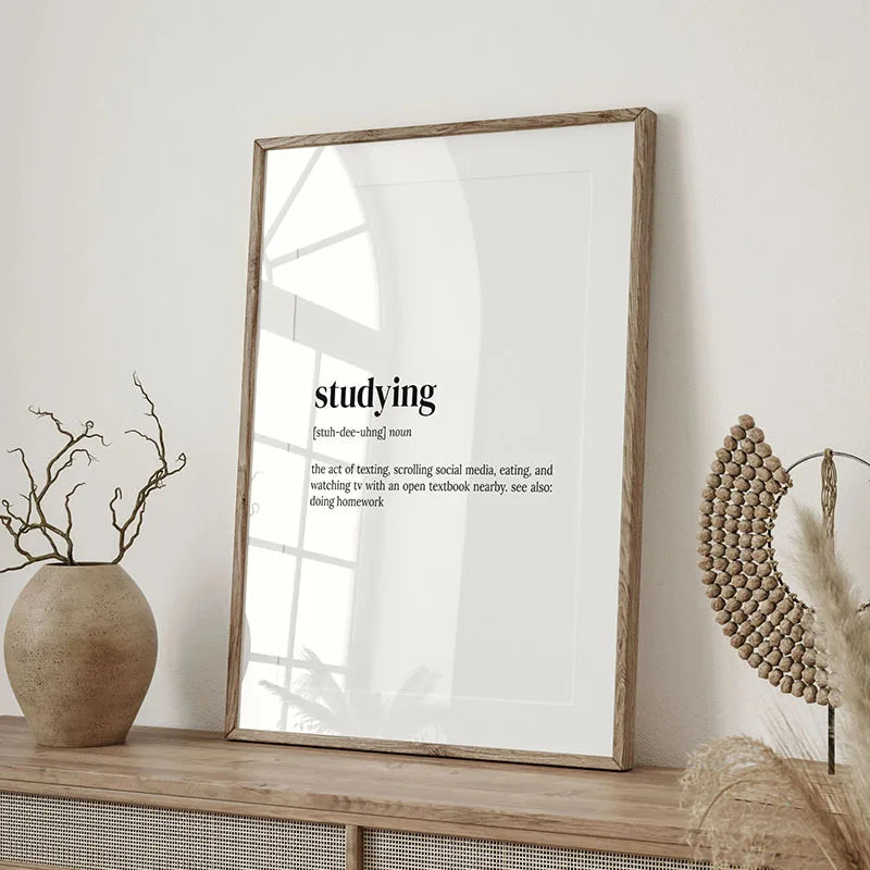 A framed canvas wall art print featuring the word studying in a minimalist style.