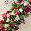 A lush silk rose garland featuring various shades of pink, red, white, and purple flowers on a wire grid.