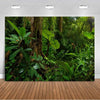 A lush, dense tropical jungle scene featuring large green leaves and tree trunks for backdrop decor.