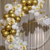 A cluster of pearl white and gold confetti balloons tied together, suggesting a wedding or celebration theme.