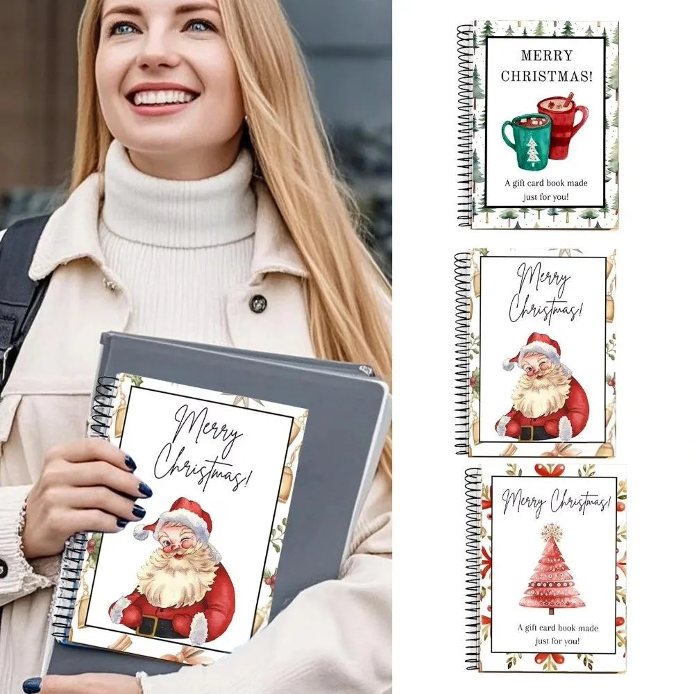 A woman holds a spiral-bound gift card book featuring Christmas designs and a festive holiday greeting.
