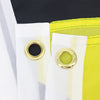 White flag tapestry with brass grommets against a yellow fabric background.
