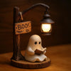 A carved wooden witch ghost lantern featuring a translucent white ghost figure and an antique-style light fixture.