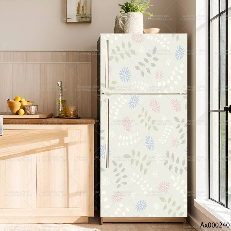 A white refrigerator with a floral pattern is displayed next to a wooden cabinet and a window.