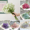 Bouquets of artificial white and purple gypsophila flowers used for wedding and home decor