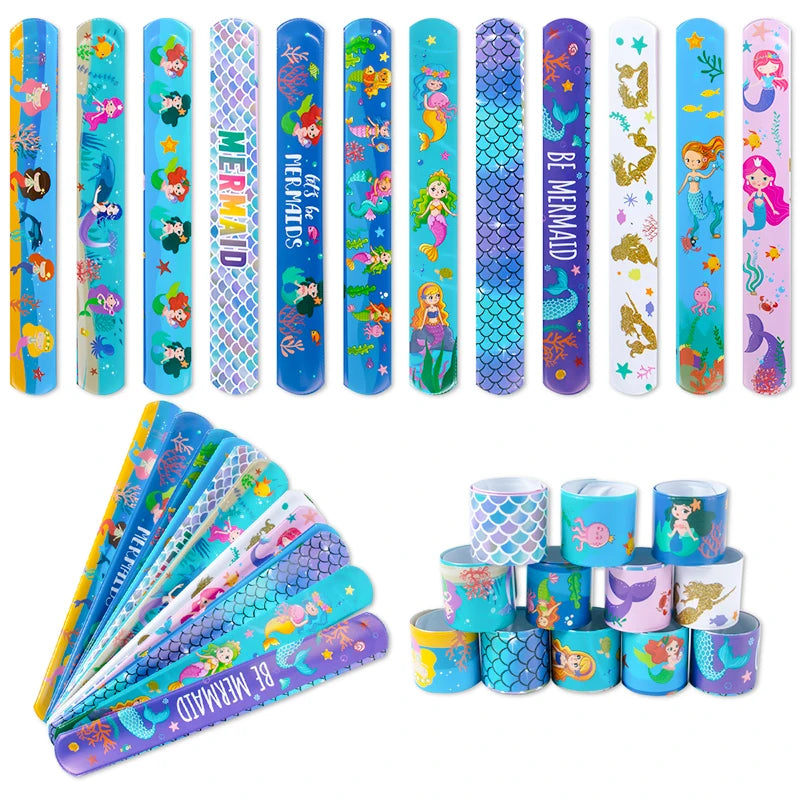 A set of colorful mermaid themed party tableware including paper plates and cups.