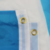 A blue and white flag fabric with a white trim and two gold grommets is shown against a white background.