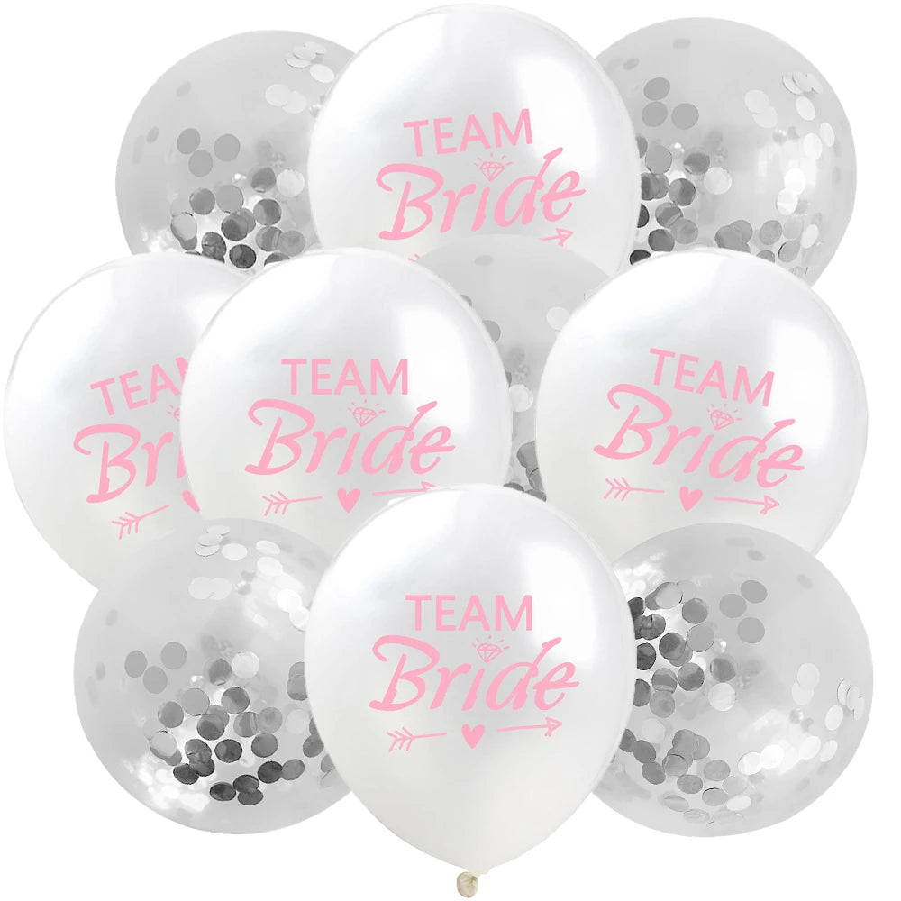 A pack of ten white latex confetti balloons with pink lettering that reads Team Bride