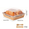 A clear plastic box containing a loaf of bread or pastry, packaged in a brown kraft cardboard tray.