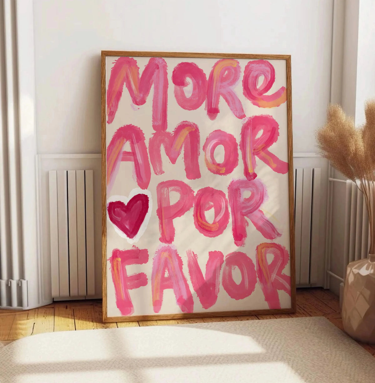 Abstract canvas wall art featuring the pink text MORE AMOR POR FAVOR on a light background.