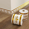 Rolls of white and gold self-adhesive PVC skirting board trim for interior finishing