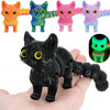 A collection of colorful 3D printed cat figurines with articulated tails displayed on a hand.