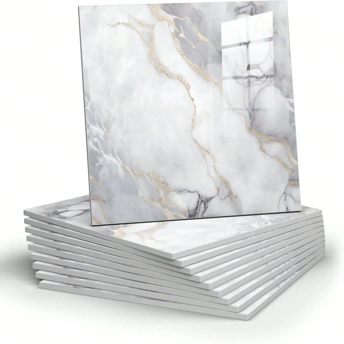 A square marble peel-and-stick wall panel featuring white marble with gold veining stacked on a white surface.