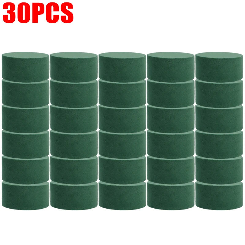 Thirty blocks of round green floral foam for flower arrangements.