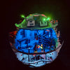 A model of the Death Star building set illuminated with green and blue LED lights.