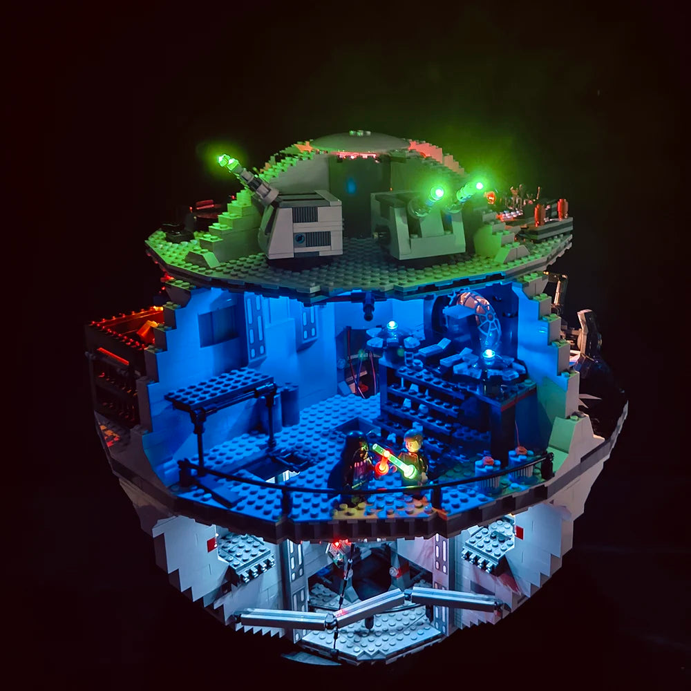 A model of the Death Star building set illuminated with green and blue LED lights.