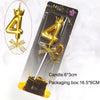 A gold 3D crown number cake candle for birthdays and celebrations, shown next to its packaging box.
