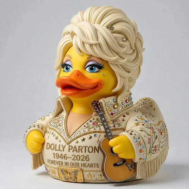A collectible figurine of a yellow duck wearing a jacket, celebrating Dolly Parton.