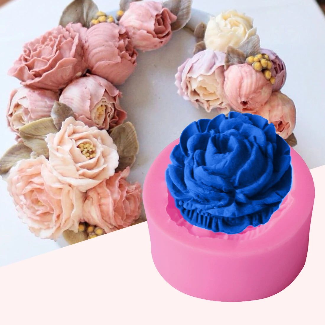 A pink silicone mold shaped like a rose flower with a blue rose decoration on a white surface.