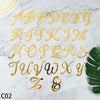 Gold acrylic alphabet and numeral cake topper set spelling out the letters A through Z and the ampersand