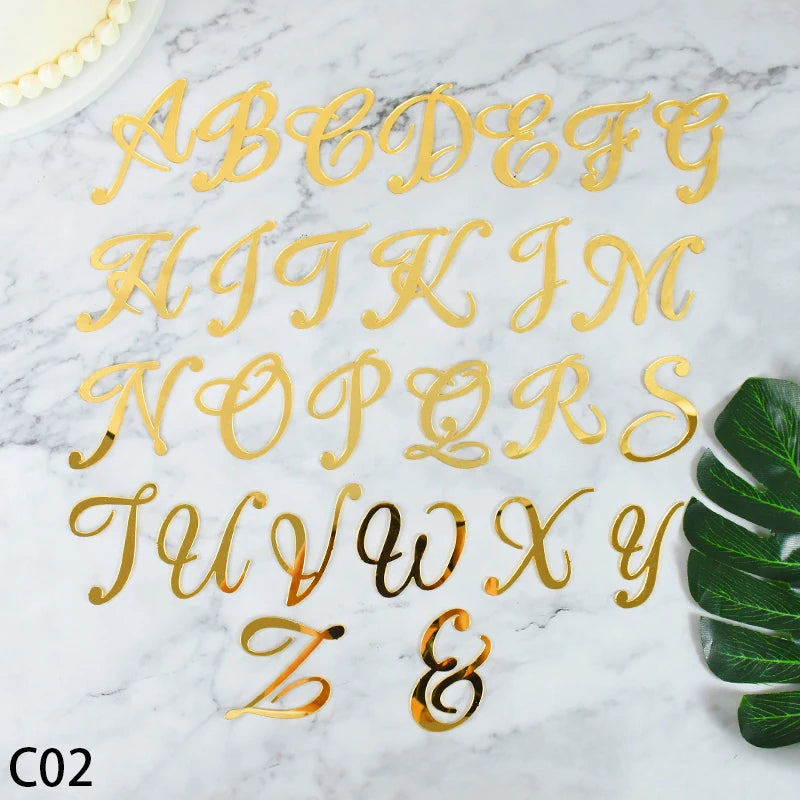 Gold acrylic alphabet and numeral cake topper set spelling out the letters A through Z and the ampersand