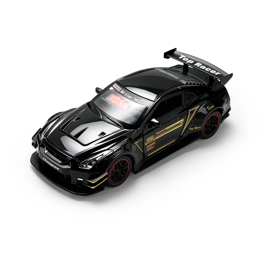 A black remote control car model with a spoiler and yellow accents is shown on a white background.