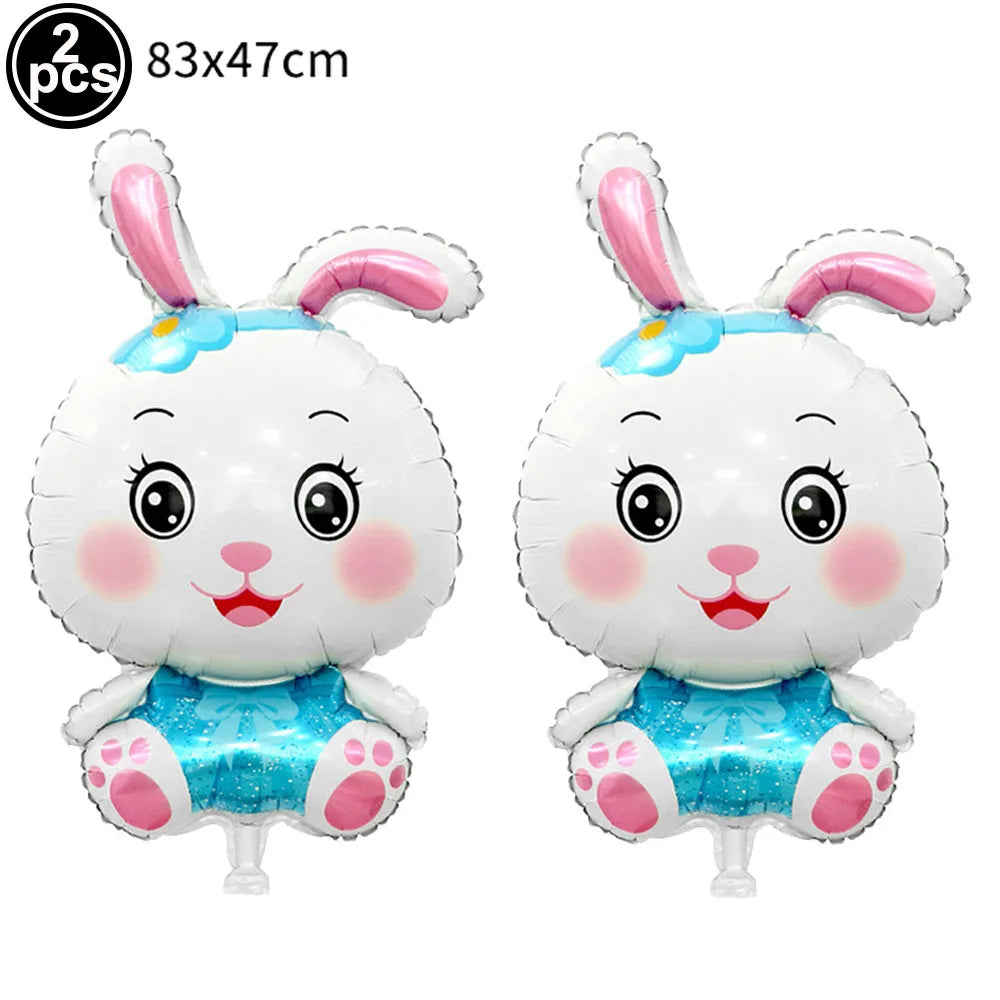 Two white bunny foil balloons with pink ears and blue accents