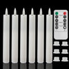 A set of white flameless LED taper candles and a remote control with timer functions.