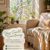 A bright window view with floral mosaic film diffusing sunlight onto a cozy interior setting.