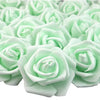 A close-up view of many light green artificial foam rose decorations arranged in a cluster.