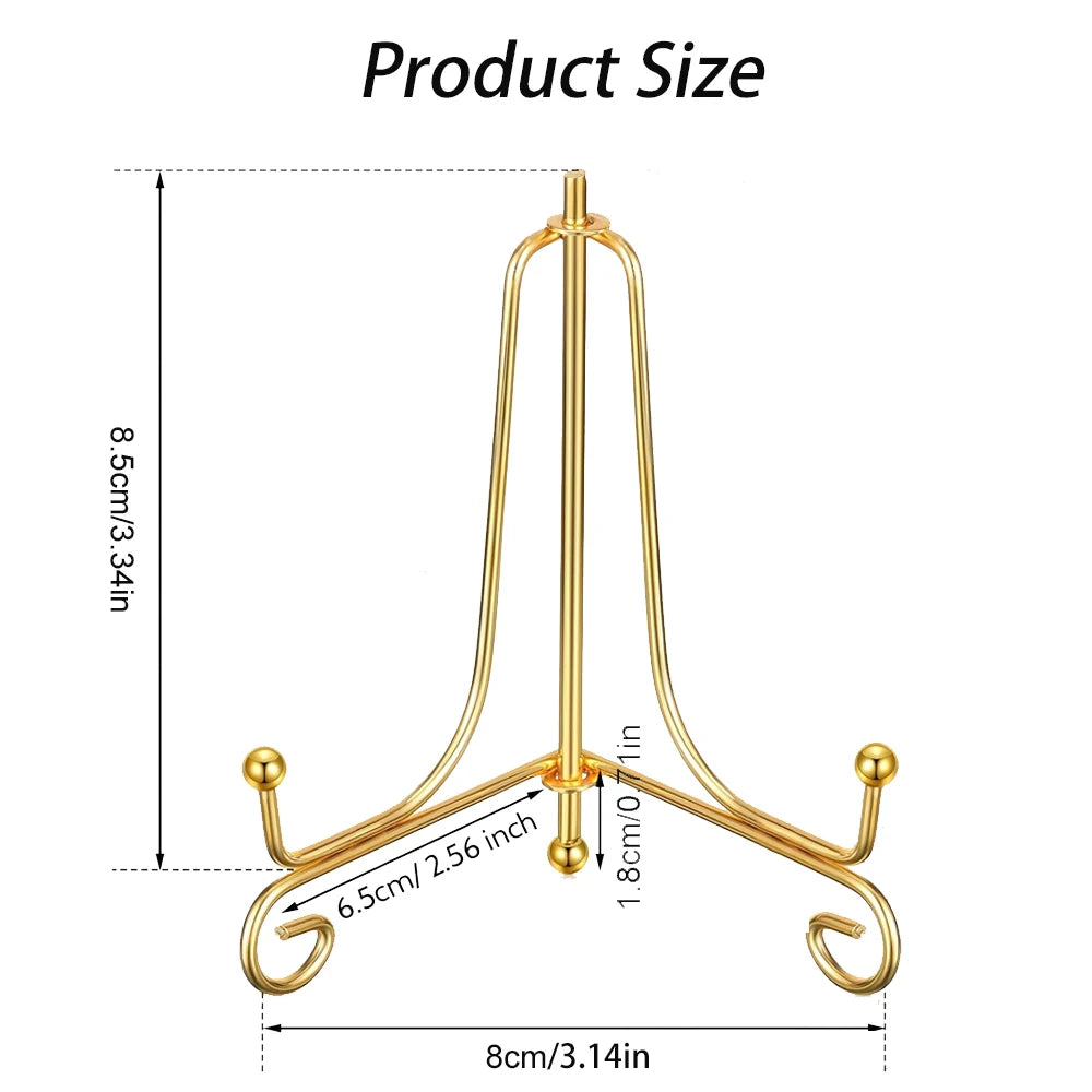 A gold-colored metal display easel with a curved stand for holding photos, plates, or collectibles.