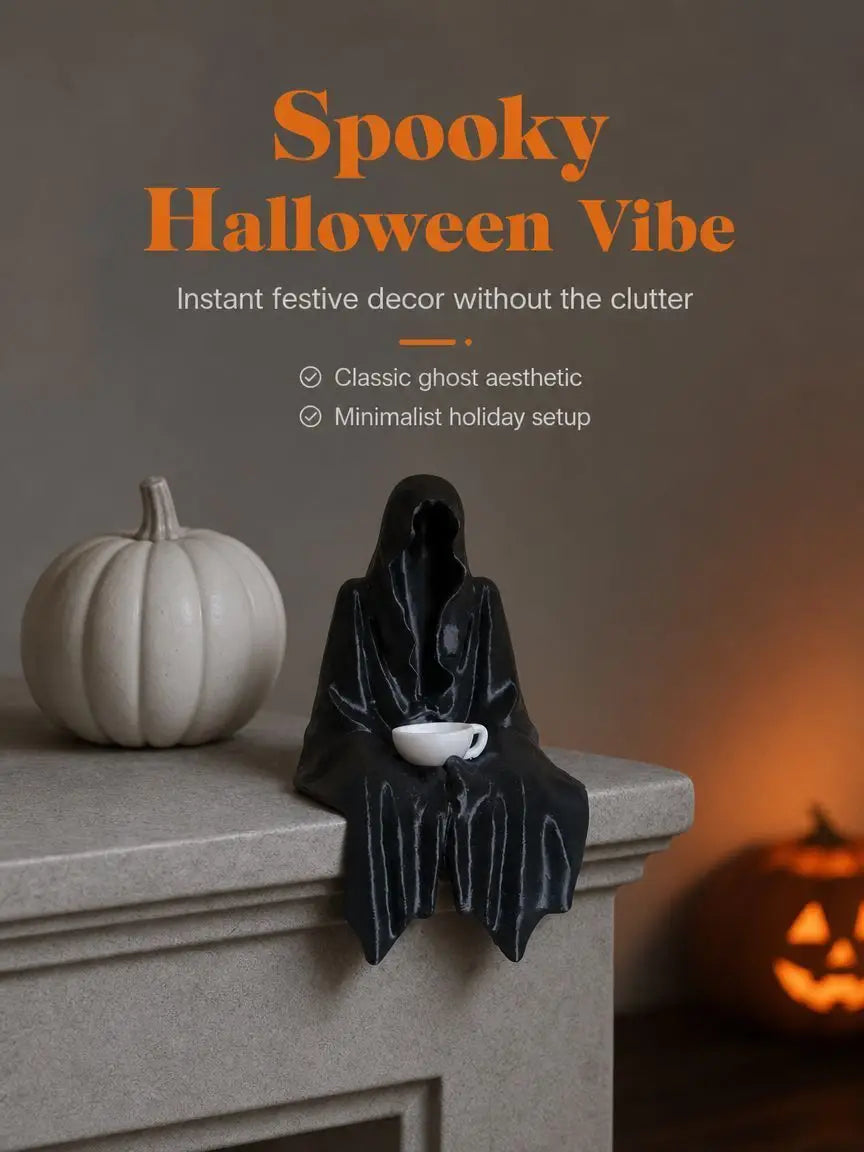 A black resin ghost figure with draped fabric sits on a mantelpiece next to a small white teacup.