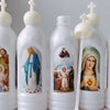 A set of clear plastic bottles containing holy water with religious imagery and white plastic droppers.